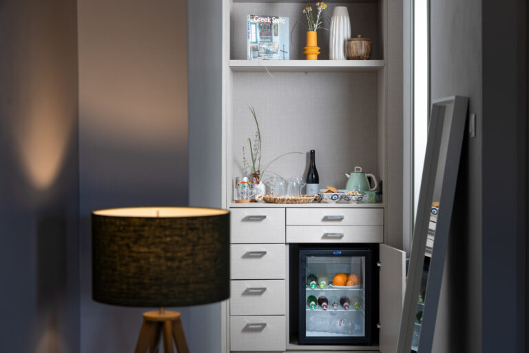 24 Storage with safe, minifridge and teakettle